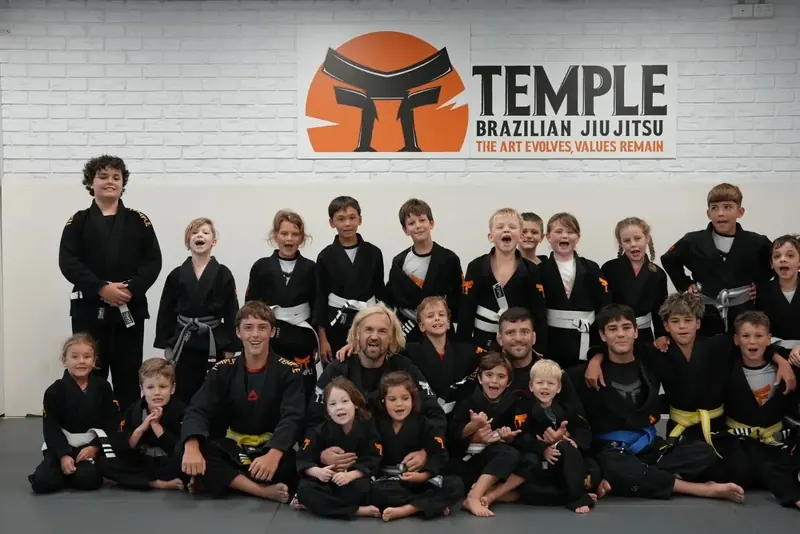 Temple BJJ kids group photo with coaches in Mooloolaba